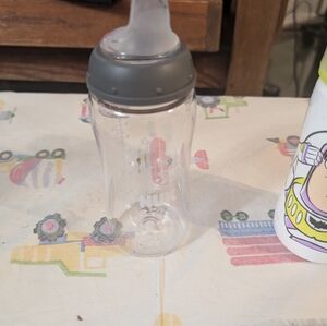 2 nuk bottles and bottle cleaner